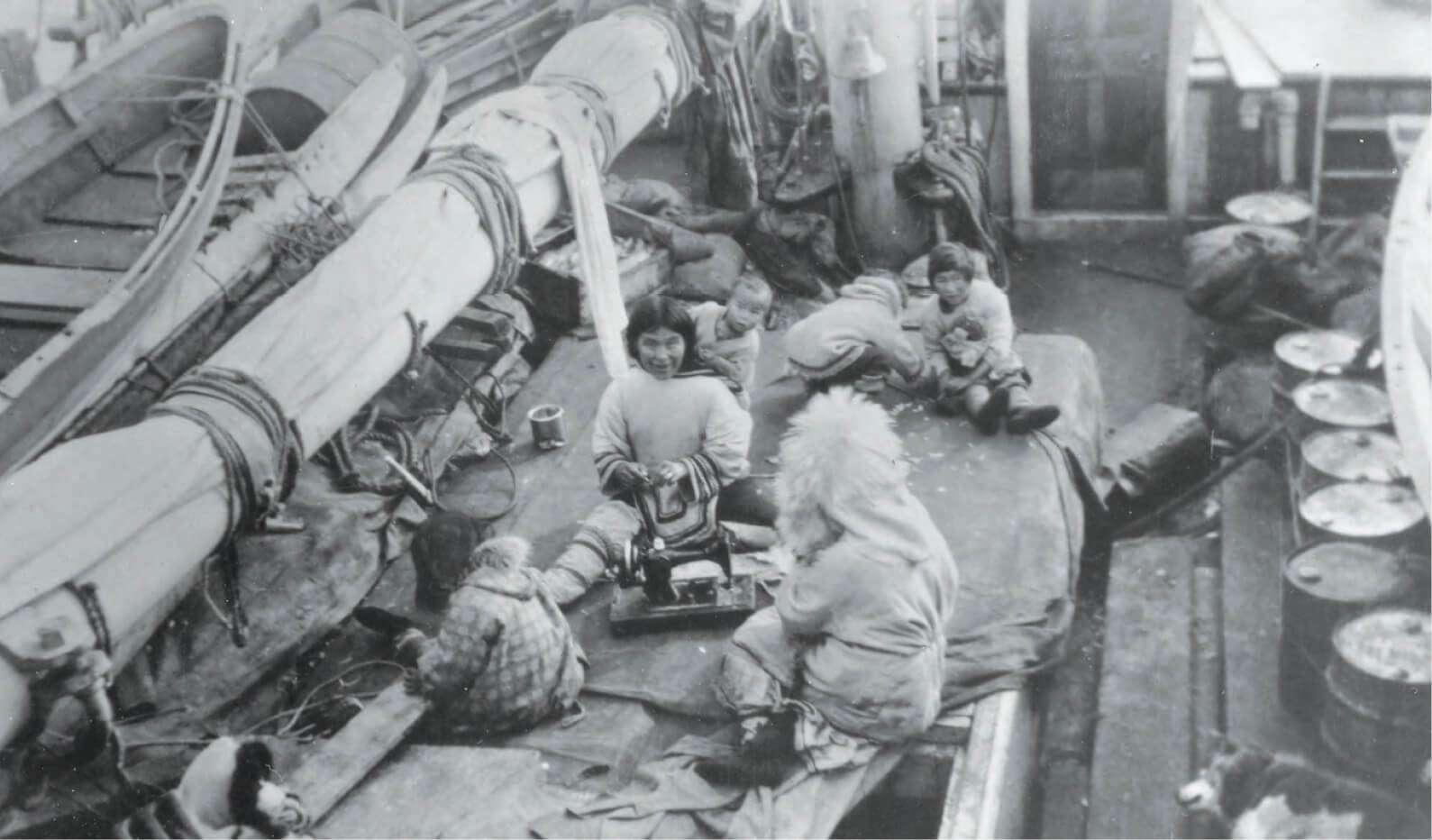 Letia and Panikpak sew with their family aboard the St. Roch ship during an August 1944 voyage.
