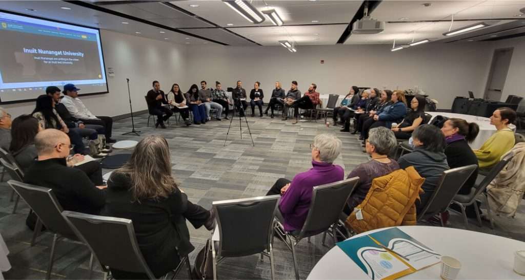 Participants seated in a circle during an Inuit Nunangat University workshop, engaging in discussions about Inuit-led higher education initiatives.